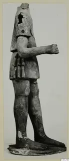 Terracotta statue of a standing figure with the head missing and one arm bent across the body