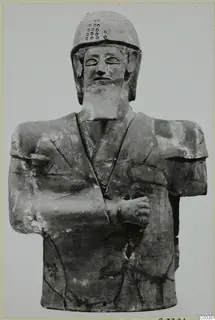 Terracotta bust of a bearded male figure in a helmet, arms folded across the chest