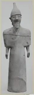 Terracotta statue of a standing figure with a tall conical headdress and short stub arms, shown against a plain grey background
