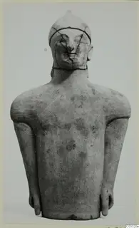 Terracotta figure of a standing figure with arms at its sides and a cracked head, seen from the front
