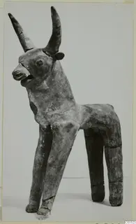 Terracotta figurine of a horned animal standing on four legs, from the Terracotta Minor Plastic series.