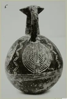 Jug with a strap handle and pale incised concentric-circle and zigzag decoration on a dark surface, from Lapithos