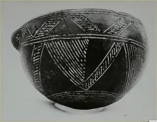 Black polished bowl from Lapithos with incised bands and triangles filled with pale lines