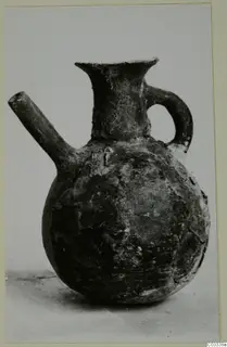 Red Polished III jug with a spout, loop handle and flared neck, from the Vrysi tou Barba tombs at Lapithos