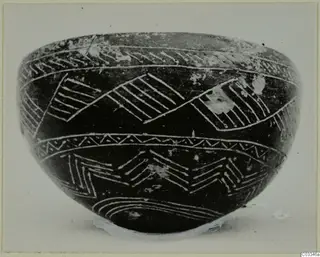 Red Polished II bowl from Lapithos with white linear decoration on a dark surface