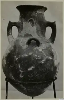 Two-handled amphora with a narrow neck and rounded body, standing on a metal ring stand, from Lapithos