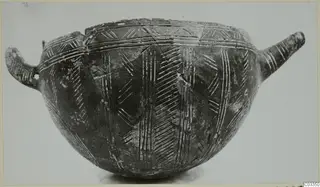 Red Polished III bowl with a loop handle on the left, a tubular handle on the right and incised linear decoration