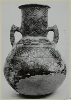 Two-handled White Painted pottery jar with black painted geometric bands, from Lapithos