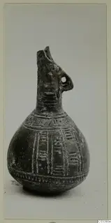 Red Polished III jug from Lapithos, Vrysi tou Barba tombs, with incised bands and a small pierced handle