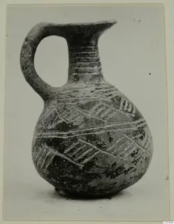 Pottery Red Polished II jug from Lapithos, with a loop handle and incised bands of hatched decoration