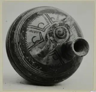 Levanto-Helladic Ware bowl-jar from Enkomi with a spout and a strap handle decorated with a spiral