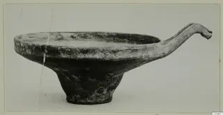 Base-Ring Ware bowl from Enkomi with a long curved handle ending in a rounded knob