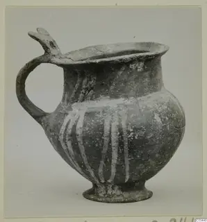 Base-Ring ware jug with a trefoil-type spout, a loop handle and white painted vertical stripes on the body.