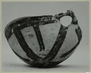Pottery White Slip Ware vessel from Enkomi with a loop handle and dark painted bands of cross-hatching
