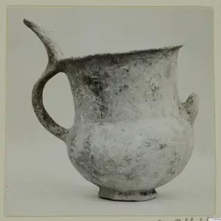 Pottery White Slip Ware vessel with a spout, a loop handle and a small lug, from Enkomi