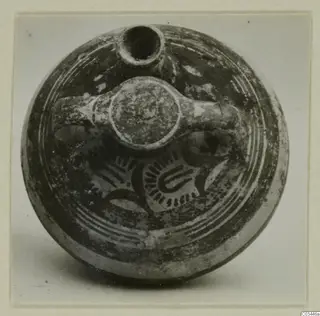 Levanto-Helladic Ware bowl-jar with a short spout, a handle on top and painted concentric bands and motifs