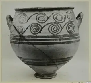 Pottery bowl-jar with two handles and spiral painted decoration around the shoulder.