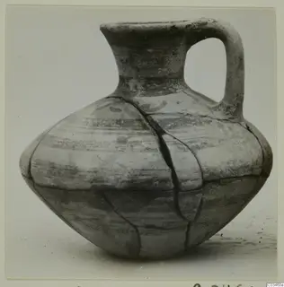 Levanto-Helladic ware bowl-jar with a loop handle, cracked, with painted bands