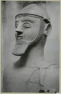 Terracotta bust of a bearded male figure wearing a close-fitting cap, three-quarter view