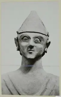 Terracotta head and shoulders with a tall conical cap and large almond-shaped eyes, seen from the front