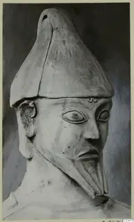 Terracotta Proto-Cypriote I, head and upper body of a bearded figure in a tall pointed headdress