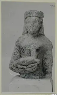 Limestone Neo-Cypriote bust of a woman holding a small figure against her chest