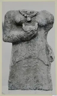 Limestone sculpture fragment of a headless human torso with the arms bent across the chest