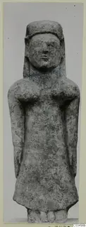Limestone statue of a standing female figure with arms at her sides, seen from the front