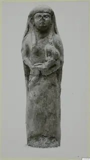 Terracotta figurine of a standing female figure, hands held at the chest, on a rough base