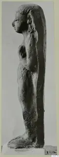 Terracotta figurine of a standing nude female figure, shown in profile facing left