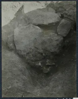 Excavation trench at Stylli with large fallen stones lying in the soil