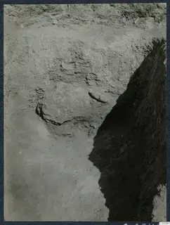 Excavation trench at Stylli with large stones embedded in the soil