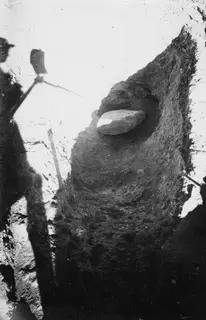 Tomb at Stylli with door packing: a large flat stone set into an excavated cut in the earth.