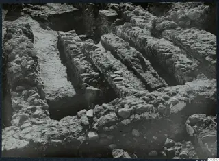 Excavated stone walls and foundations at Soli, Cholades Temples C-F, running diagonally across a trench