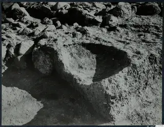 Rounded offering pit cut into excavated soil at Cholades, Room XLIII A, Soli, after excavation.