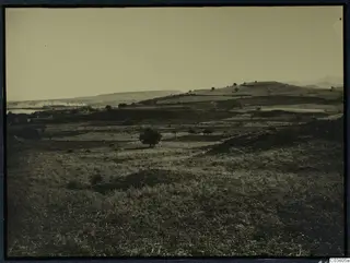 View of the acropolis at Soli from the north-west, across fields and rounded hills.