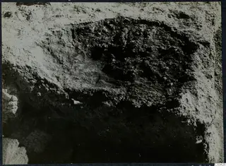 Excavation with stones at Cholades, Soli, showing a dark cut in pale excavated soil