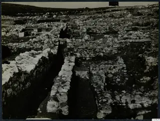Excavated stone walls and foundations at Soli, Cholades temples, seen from above across a trench.