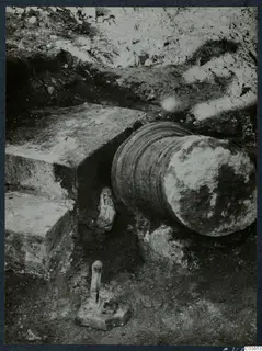 Finds in situ at Cholades, Soli: stone steps, a fallen fluted column drum and small carved figures in excavated ground.