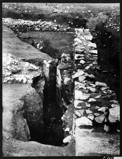 Excavation trench with exposed stone walls at Soli, Cholades Temples A-B
