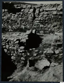 Excavated stone walls and a stone-lined pit at Soli, Cholades temples