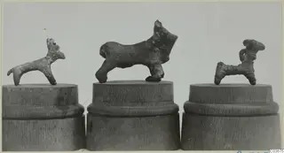 Three small bronze figurines of animals on wooden stands