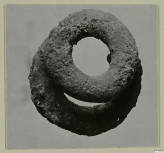Corroded ring-shaped silver object from Vouni, seen from above