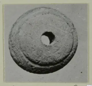Disc-shaped object with a central hole, from Vouni, shown from above.