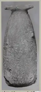 Tall alabaster vase with a flat, wide rim and tapering body, from Vouni