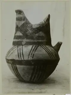 White Painted IV-V pottery vessel from Enkomi with dark painted bands, hatched triangles and a broken neck