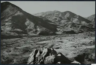 View over the Kambos valley at Soli, with hills rising behind a dry open valley floor