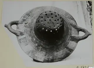 Pottery Bichrome II vessel with two handles, a perforated central top and painted bands around the body