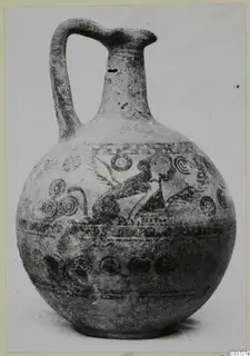 Bichrome IV plate-jug with a globular body, high strap handle and painted bands and concentric circles