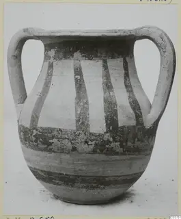 Two-handled painted pottery vessel with dark vertical and horizontal bands on a pale surface